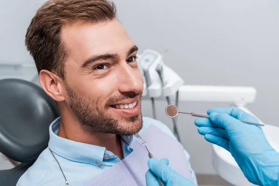 A man having his 6 monthly dental checkup